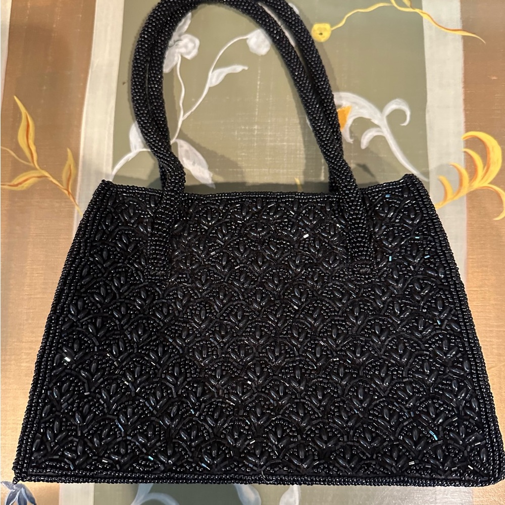 Dressy Beaded Black handbag with zipper closure.